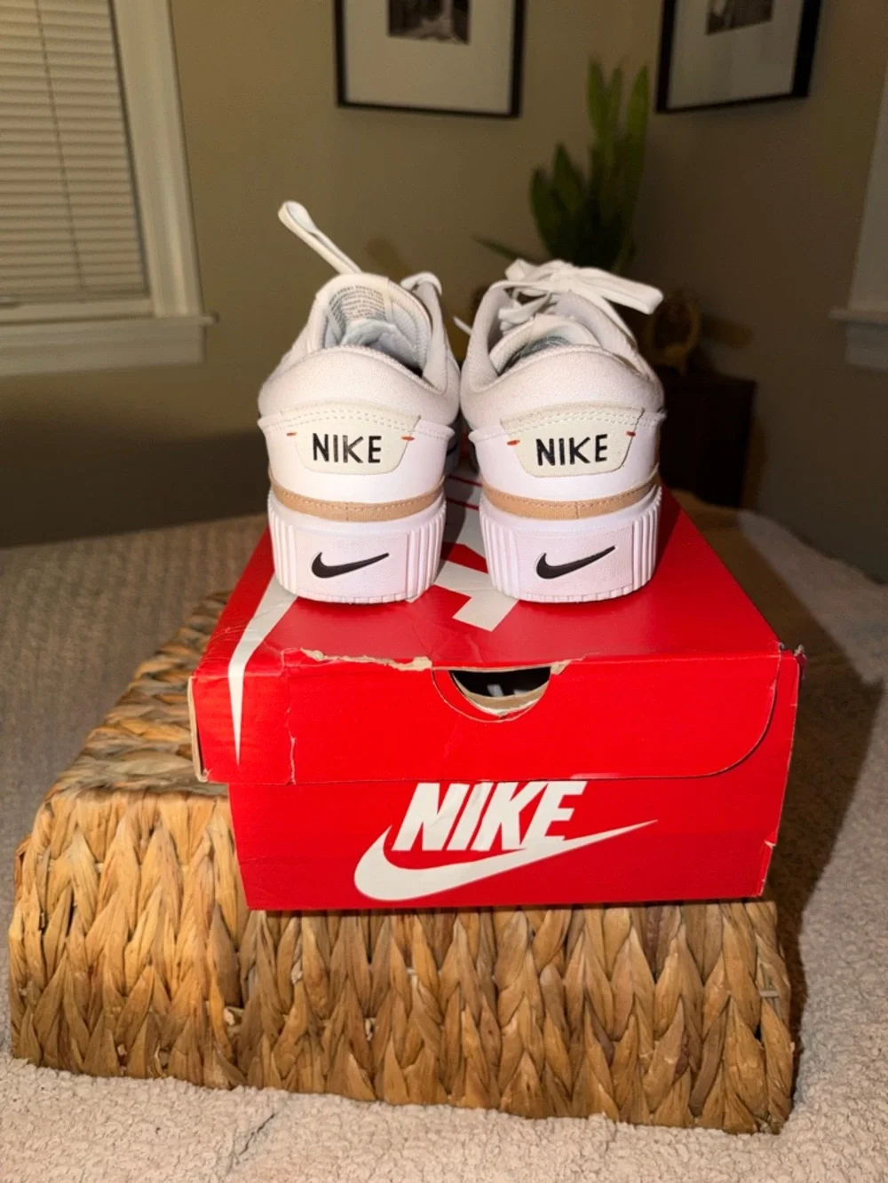 Nike White Low-Top Sneakers with Black Swoosh and Tan Stripe